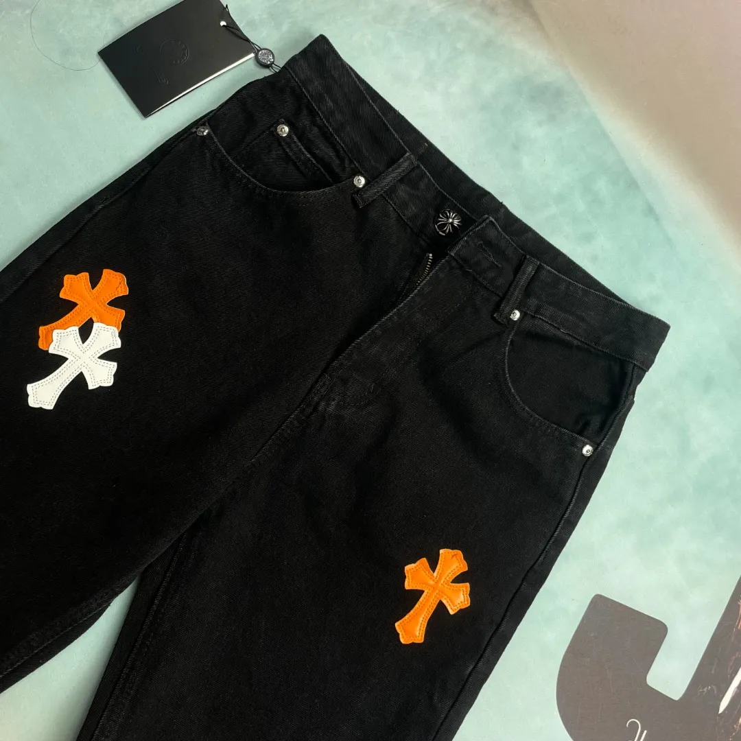 🅿️290 🔘Style No.-KL161 🔘Cross Heart𝐂𝐡𝐫𝐨𝐦𝐞 𝐇𝐞𝐚𝐫𝐭 City Limited Sanskrit Cross Patched Leather Jeans* These two pairs of Cros Heart city limited series jeans! This is an ultra-limited edition launched by Kroxin, a hard currency in the fashion circle! The overall material of the pants is classic black denim, which has a great texture, feels crisp yet soft, and is extremely durable. The colorful crosses and letter patterns on it are a highlight. The crosses come in orange, white, red and other colors. They are presented through exquisite embroidery technology. They are full of three-dimensionality, bright and not easy to fade. The letter patterns are also exquisitely embroidered, and they complement each other with the cross, which directly adds to the sense of fashion. In terms of production technology, Croxin has always strived for excellence. The wiring is very neat, every stitch is just right, and the hardware accessories are also customized, such as buttons and zippers. They are not only durable, but also have Croxin's iconic detailed design, which is full of high-end feeling. The shape is an unobtrusive straight design, which can well modify the shape of the legs. Whether you have thick or thin legs, they will look good on you. Moreover, this style is very versatile and can be easily worn in various styles. Here are some matching suggestions: Street style: Pair your upper body with a loose white hooded sweatshirt, a black Crocodile leather jacket, and a pair of black high-top Converse or Martin boots for a cool and handsome look. If you add Kroxin's silver necklace or ring, the overall look will be more complete. Casual chic: A simple short-sleeved T-shirt in a solid color, such as black, gray or white, will look great with these pants. Put on a pair of white Nike sneakers and carry a Crouching crossbody bag, and you will be both comfortable and fashionable on the street every day. Retro style: You can choose a floral shirt, tuck the hem into your pants, and pair it with a pair of retro western boots or designer shoes to instantly create a retro and personalized atmosphere. These pants are really a must-have fashion item, and they can also be matched as a pair for couples. You can pair them with your partner and be the center of attention when out on the street! If you like fashion, don’t miss it!  Size: S M L XL (28.30.32.34) Color: black with red, black with orange